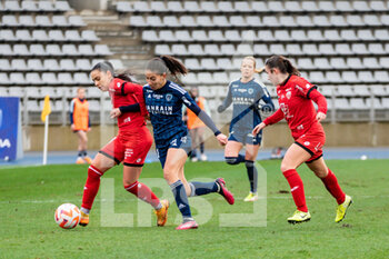 2023-02-04 - Meriame Terchoun of Dijon FCO and Clara Mateo of Paris FC fight for the ball during the Women's French championship, D1 Arkema football match between Paris FC and Dijon FCO on February 4, 2023 at Sebastien Charlety stadium in Paris, France - FOOTBALL - WOMEN'S FRENCH CHAMP - PARIS FC V DIJON - FRENCH WOMEN DIVISION 1 - SOCCER