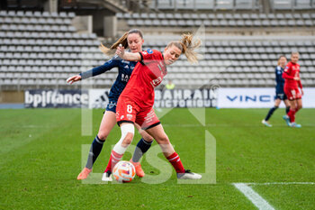 2023-02-04 - Margaux Le Mouel of Paris FC and Lea Declercq of Dijon FCO fight for the ball during the Women's French championship, D1 Arkema football match between Paris FC and Dijon FCO on February 4, 2023 at Sebastien Charlety stadium in Paris, France - FOOTBALL - WOMEN'S FRENCH CHAMP - PARIS FC V DIJON - FRENCH WOMEN DIVISION 1 - SOCCER