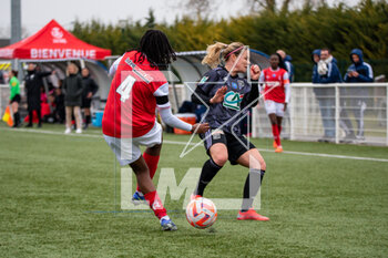 2023-03-04 - Jade Rastocle of Stade de Reims and Eugenie Le Sommer of Olympique Lyonnais fight for the ball during the Women's French Cup, Quarter-Finals football match between Stade de Reims and Olympique Lyonnais (Lyon) on March 4, 2023 at Blériot stadium in Bétheny near Reims, France - FOOTBALL - WOMEN'S FRENCH CUP - REIMS V LYON - FRENCH WOMEN DIVISION 1 - SOCCER