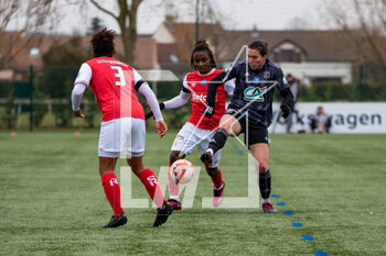 2023-03-04 - Melchie Dumornay of Stade de Reims and Vanessa Gilles of Olympique Lyonnais fight for the ball during the Women's French Cup, Quarter-Finals football match between Stade de Reims and Olympique Lyonnais (Lyon) on March 4, 2023 at Blériot stadium in Bétheny near Reims, France - FOOTBALL - WOMEN'S FRENCH CUP - REIMS V LYON - FRENCH WOMEN DIVISION 1 - SOCCER