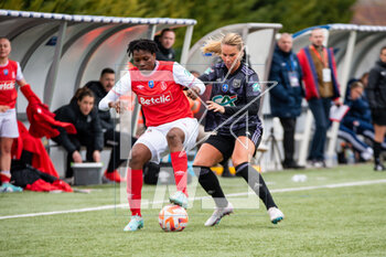 2023-03-04 - Kethna Louis of Stade de Reims and Amandine Henry of Olympique Lyonnais fight for the ball during the Women's French Cup, Quarter-Finals football match between Stade de Reims and Olympique Lyonnais (Lyon) on March 4, 2023 at Blériot stadium in Bétheny near Reims, France - FOOTBALL - WOMEN'S FRENCH CUP - REIMS V LYON - FRENCH WOMEN DIVISION 1 - SOCCER