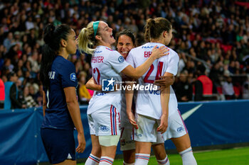 2023-05-21 - Ellie Carpenter of Olympique Lyonnais, Amel Majri of Olympique Lyonnais and Signe Bruun of Olympique Lyonnais celebrate the victory after the Women's French championship D1 Arkema football match between Paris Saint-Germain and Olympique Lyonnais (Lyon) on May 21, 2023 at Parc des Princes stadium in Paris, France - FOOTBALL - WOMEN'S FRENCH CHAMP - PARIS SG V LYON - FRENCH WOMEN DIVISION 1 - SOCCER