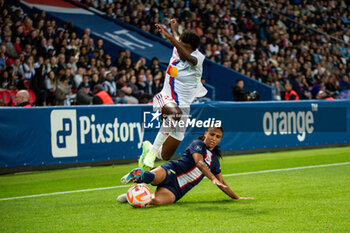 2023-05-21 - Vicki Becho of Olympique Lyonnais and Sakina Karchaoui of Paris Saint Germain fight for the ball during the Women's French championship D1 Arkema football match between Paris Saint-Germain and Olympique Lyonnais (Lyon) on May 21, 2023 at Parc des Princes stadium in Paris, France - FOOTBALL - WOMEN'S FRENCH CHAMP - PARIS SG V LYON - FRENCH WOMEN DIVISION 1 - SOCCER