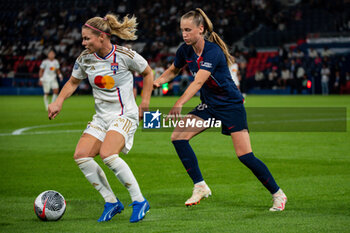 2023-09-15 - Eugenie Le Sommer of Olympique Lyonnais and Jade Le Guilly of Paris Saint Germain fight for the ball during the women’s French championship D1 Arkema football match between Paris Saint Germain and Olympique Lyonnais on October 1, 2023 at Parc des Princes stadium in Paris, France - FOOTBALL - WOMEN FRENCH CHAMP - PARIS SG V LYON - FRENCH WOMEN DIVISION 1 - SOCCER