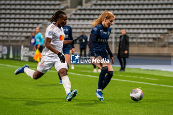 2023-11-05 - Melchie Dumornay of Olympique Lyonnais and Celina Ould Hocine of Paris FC fight for the ball during the Women's French championship, D1 Arkema football match between Paris FC and Olympique Lyonnais (Lyon) on November 5, 2023 at Sébastien Charléty stadium in Paris, France - FOOTBALL - WOMEN'S FRENCH CHAMP - PARIS FC V LYON - FRENCH WOMEN DIVISION 1 - SOCCER
