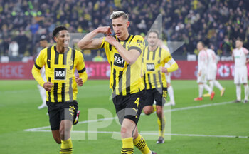 2023-01-22 - Nico Schlotterbeck of Dortmund celebrates his goal 2-1 with Jude Bellingham during the German championship Bundesliga football match between Borussia Dortmund and FC Augsburg on January 22, 2023 at Signal Iduna Park in Dortmund, Germany - FOOTBALL - GERMAN CHAMP - DORTMUND V AUGSBURG - GERMAN BUNDESLIGA - SOCCER
