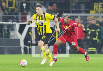 2023-03-03 - Niklas Sule of Dortmund and Benjamin Henrichs of Leipzig during the German championship Bundesliga football match between Borussia Dortmund and RB Leipzig on March 3, 2023 at Signal Iduna Park in Dortmund, Germany - FOOTBALL - GERMAN CHAMP - DORTMUND V LEIPZIG - GERMAN BUNDESLIGA - SOCCER