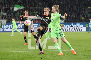 2023-03-12 - Morten Thorsby of Union Berlin and Patrick Wimmer of Wolfsburg during the German championship Bundesliga football match between VfL Wolfsburg and FC Union Berlin on March 12, 2023 at Volkswagen Arena in Wolfsburg, Germany - FOOTBALL - GERMAN CHAMP - WOLFSBURG V UNION BERLIN - GERMAN BUNDESLIGA - SOCCER