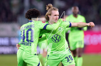 2023-03-12 - Patrick Wimmer of Wolfsburg celebrates his goal 1-1 with Kevin Paredes during the German championship Bundesliga football match between VfL Wolfsburg and FC Union Berlin on March 12, 2023 at Volkswagen Arena in Wolfsburg, Germany - FOOTBALL - GERMAN CHAMP - WOLFSBURG V UNION BERLIN - GERMAN BUNDESLIGA - SOCCER