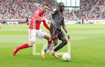 2023-04-22 - Sadio Mane of Bayern Munich and Stefan Bell of Mainz during the German championship Bundesliga football match between FSV Mainz 05 and Bayern Munich on April 22, 2023 at Mewa Arena in Mainz, Germany - FOOTBALL - GERMAN CHAMP - MAINZ V BAYERN MUNICH - GERMAN BUNDESLIGA - SOCCER