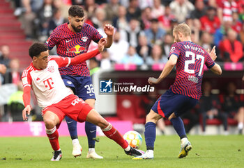 2023-05-20 - Jamal Musiala of Bayern Munich and Josko Gvardiol, Konrad Laimer of RB Leipzig during the German championship Bundesliga football match between Bayern Munich and RB Leipzig on May 20, 2023 at Allianz Arena in Munich, Germany - FOOTBALL - GERMAN CHAMP - BAYERN MUNICH V RB LEIPZIG - GERMAN BUNDESLIGA - SOCCER