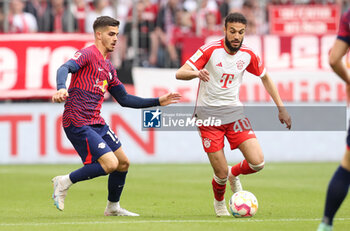 2023-05-20 - Noussair Mazraoui of Bayern Munich and Andre Silva of RB Leipzig during the German championship Bundesliga football match between Bayern Munich and RB Leipzig on May 20, 2023 at Allianz Arena in Munich, Germany - FOOTBALL - GERMAN CHAMP - BAYERN MUNICH V RB LEIPZIG - GERMAN BUNDESLIGA - SOCCER