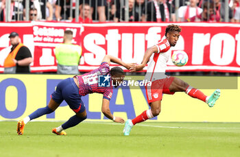 2023-05-20 - Christopher Nkunku of RB Leipzig and Kingsley Coman of Bayern Munich during the German championship Bundesliga football match between Bayern Munich and RB Leipzig on May 20, 2023 at Allianz Arena in Munich, Germany - FOOTBALL - GERMAN CHAMP - BAYERN MUNICH V RB LEIPZIG - GERMAN BUNDESLIGA - SOCCER