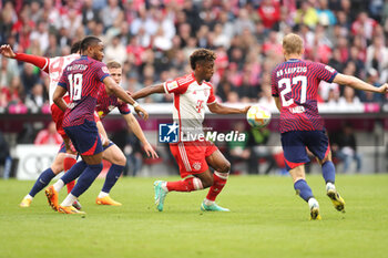 2023-05-20 - Kingsley Coman of Bayern Munich and Christopher Nkunku, Konrad Laimer of RB Leipzig during the German championship Bundesliga football match between Bayern Munich and RB Leipzig on May 20, 2023 at Allianz Arena in Munich, Germany - FOOTBALL - GERMAN CHAMP - BAYERN MUNICH V RB LEIPZIG - GERMAN BUNDESLIGA - SOCCER