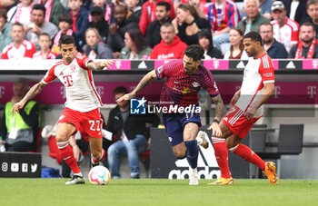 2023-05-20 - Joao Cancelo of Bayern Munich, Dominik Szoboszlai of RB Leipzig, Serge Gnabry of Bayern Munich during the German championship Bundesliga football match between Bayern Munich and RB Leipzig on May 20, 2023 at Allianz Arena in Munich, Germany - FOOTBALL - GERMAN CHAMP - BAYERN MUNICH V RB LEIPZIG - GERMAN BUNDESLIGA - SOCCER