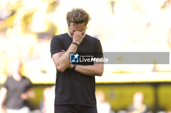 2023-05-27 - Borussia Dortmund coach Edin Terzic looks dejected after the German championship Bundesliga football match between Borussia Dortmund and FSV Mainz on May 27, 2023 at Signal Iduna Park in Dortmund, Germany - FOOTBALL - GERMAN CHAMP - DORTMUND V MAINZ - GERMAN BUNDESLIGA - SOCCER