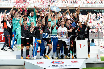 2023-05-27 - Bayern Munich players celebrating the German title after the German championship Bundesliga football match between FC Koln and Bayern Munich on May 27, 2023 at RheinEnergieStadion in Koln, Germany - FOOTBALL - GERMAN CHAMP - KOLN V BAYERN MUNICH - GERMAN BUNDESLIGA - SOCCER