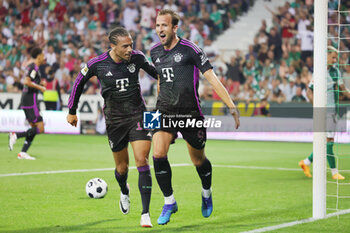 2023-08-18 - Harry Kane of Bayern Munich celebrates his goal 0-2 with Leroy Sane during the German championship Bundesliga football match between Werder Bremen and Bayern Munich on August 18, 2023 at Weserstadion in Bremen, Germany - FOOTBALL - GERMAN CHAMP - WERDER BREMEN V BAYERN MUNICH - GERMAN BUNDESLIGA - SOCCER