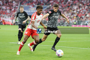 2023-10-08 - Kingsley Coman of Bayern Munich and Merlin Rohl of Freiburg during the German championship Bundesliga football match between Bayern Munich and SC Freiburg on October 8, 2023 at Allianz Arena in Munich, Germany - FOOTBALL - GERMAN CHAMP - BAYERN MUNICH V FREIBURG - GERMAN BUNDESLIGA - SOCCER