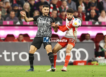 2023-10-08 - Vincenzo Grifo of Freiburg and Noussair Mazraoui of Bayern Munich during the German championship Bundesliga football match between Bayern Munich and SC Freiburg on October 8, 2023 at Allianz Arena in Munich, Germany - FOOTBALL - GERMAN CHAMP - BAYERN MUNICH V FREIBURG - GERMAN BUNDESLIGA - SOCCER