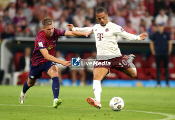 2023-08-12 - Leroy Sane of Bayern Munich and Dani Olmo of RB Leipzig during the DFL Supercup 2023, German SuperCup football match between Bayern Munich and RB Leipzig on August 12, 2023 at Allianz Arena in Munich, Germany - FOOTBALL - GERMAN SUPERCUP - BAYERN MUNICH V RB LEIPZIG - GERMAN SUPERCUP - SOCCER