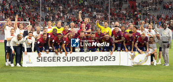 2023-08-12 - RB Leipzig players celebrate after winning the DFL Supercup 2023, German SuperCup football match between Bayern Munich and RB Leipzig on August 12, 2023 at Allianz Arena in Munich, Germany - FOOTBALL - GERMAN SUPERCUP - BAYERN MUNICH V RB LEIPZIG - GERMAN SUPERCUP - SOCCER