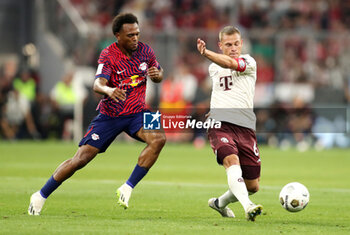 2023-08-12 - Joshua Kimmich of Bayern Munich and Lois Openda of RB Leipzig during the DFL Supercup 2023, German SuperCup football match between Bayern Munich and RB Leipzig on August 12, 2023 at Allianz Arena in Munich, Germany - FOOTBALL - GERMAN SUPERCUP - BAYERN MUNICH V RB LEIPZIG - GERMAN SUPERCUP - SOCCER
