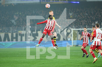 2023-03-12 - 38 DIADIÉ SAMASSÉKOU of Olympiacos FC competing with 6 JENS JØNSSON of AEK FC during the Greek Super League, Matchday 26, match between AEK FC and Olympiacos FC at OPAP Arena on March 12, 2023, in Athens, Greece. - AEK FC VS OLYMPIACOS FC - GREEK SUPER LEAGUE - SOCCER