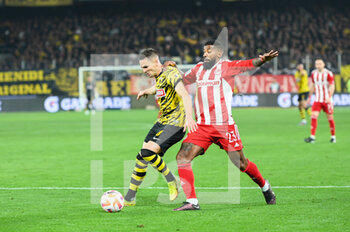 2023-03-12 - 8 MIJAT GAĆINOVIĆ of AEK FC competing with 23 RODINEI of Olympiacos FC during the Greek Super League, Matchday 26, match between AEK FC and Olympiacos FC at OPAP Arena on March 12, 2023, in Athens, Greece. - AEK FC VS OLYMPIACOS FC - GREEK SUPER LEAGUE - SOCCER