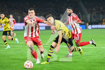 2023-03-12 - 8 MIJAT GAĆINOVIĆ of AEK FC competing with 74 ANDREAS NTOI of Olympiacos FC during the Greek Super League, Matchday 26, match between AEK FC and Olympiacos FC at OPAP Arena on March 12, 2023, in Athens, Greece. - AEK FC VS OLYMPIACOS FC - GREEK SUPER LEAGUE - SOCCER