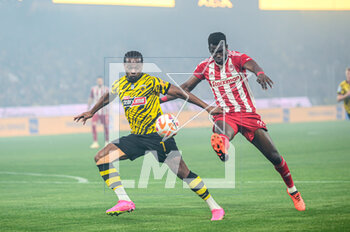 2023-05-03 - 7 LEVI GARCIA of AEK FC competing with 24 OUSSEYNOU BA of Olympiacos FC during the Greek Super League, playoff match between AEK FC and Olympiacos FC at OPAP Arena on May 3, 2023, in Athens, Greece. - AEK VS OLYMPIACOS - GREEK SUPER LEAGUE - SOCCER