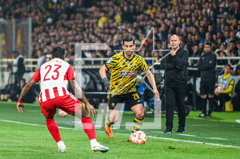 2023-05-03 - 28 EHSAN HAJISAFI of AEK FC with 23 RODINEI of Olympiacos FC during the Greek Super League, playoff match between AEK FC and Olympiacos FC at OPAP Arena on May 3, 2023, in Athens, Greece. - AEK VS OLYMPIACOS - GREEK SUPER LEAGUE - SOCCER