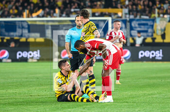 2023-05-03 - 8 MIJAT GAĆINOVIĆ of AEK FC with 23 RODINEI of Olympiacos FC during the Greek Super League, playoff match between AEK FC and Olympiacos FC at OPAP Arena on May 3, 2023, in Athens, Greece. - AEK VS OLYMPIACOS - GREEK SUPER LEAGUE - SOCCER