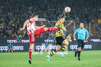2023-05-03 - 10 STEVEN ZUBER of AEK FC competing with 15 SOKRATIS PAPASTATHOPOULOS of Olympiacos FC during the Greek Super League, playoff match between AEK FC and Olympiacos FC at OPAP Arena on May 3, 2023, in Athens, Greece. - AEK VS OLYMPIACOS - GREEK SUPER LEAGUE - SOCCER