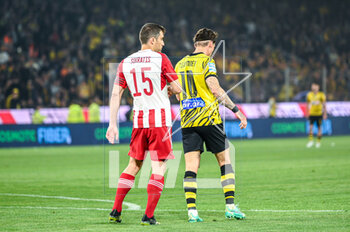 2023-05-03 - 10 STEVEN ZUBER of AEK FC competing with 15 SOKRATIS PAPASTATHOPOULOS of Olympiacos FC during the Greek Super League, playoff match between AEK FC and Olympiacos FC at OPAP Arena on May 3, 2023, in Athens, Greece. - AEK VS OLYMPIACOS - GREEK SUPER LEAGUE - SOCCER