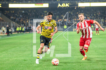 2023-05-03 - 3 MILAD MOHAMMADI of AEK FC competing with 45 OLEG REABCIUK of Olympiacos FC during the Greek Super League, playoff match between AEK FC and Olympiacos FC at OPAP Arena on May 3, 2023, in Athens, Greece. - AEK VS OLYMPIACOS - GREEK SUPER LEAGUE - SOCCER