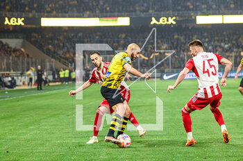 2023-05-03 - 5 NORDIN AMRABAT of AEK FC competing with 7 KOSTAS FORTOUNIS and 45 OLEG REABCIUK of Olympiacos FC during the Greek Super League, playoff match between AEK FC and Olympiacos FC at OPAP Arena on May 3, 2023, in Athens, Greece. - AEK VS OLYMPIACOS - GREEK SUPER LEAGUE - SOCCER
