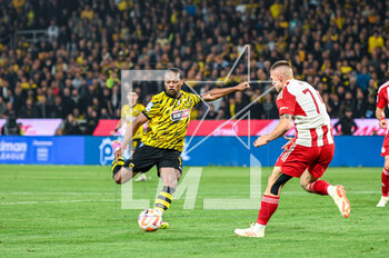 2023-05-03 - 7 LEVI GARCIA of AEK FC competing with 74 ANDREAS NTOI of Olympiacos FC during the Greek Super League, playoff match between AEK FC and Olympiacos FC at OPAP Arena on May 3, 2023, in Athens, Greece. - AEK VS OLYMPIACOS - GREEK SUPER LEAGUE - SOCCER