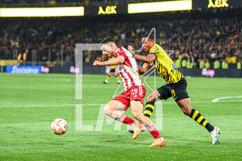 2023-05-03 - 19 NICLAS ELIASSON of AEK FC competing with 19 GIORGOS MASOURAS of Olympiacos FC during the Greek Super League, playoff match between AEK FC and Olympiacos FC at OPAP Arena on May 3, 2023, in Athens, Greece. - AEK VS OLYMPIACOS - GREEK SUPER LEAGUE - SOCCER