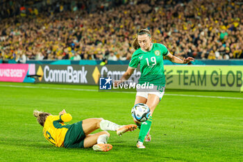 2023-07-20 - Katrina Gorry (19) of Australia slides in and tackles Abbie Larkin (19) of Republic of Ireland during the 2023 FIFA Women’s World Cup, Group B football match between Australia and Republic of Ireland on 20 July 2023 at Stadium Australia in Sydney, Australia - FOOTBALL - WOMEN'S WORLD CUP 2023 - AUSTRALIA V REPUBLIC OF IRELAND - FIFA WORLD CUP - SOCCER