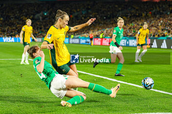 2023-07-20 - Heather Payne (14) of Republic of Ireland slides in and tackles Caitlin Foord (9) of Australia during the 2023 FIFA Women’s World Cup, Group B football match between Australia and Republic of Ireland on 20 July 2023 at Stadium Australia in Sydney, Australia - FOOTBALL - WOMEN'S WORLD CUP 2023 - AUSTRALIA V REPUBLIC OF IRELAND - FIFA WORLD CUP - SOCCER