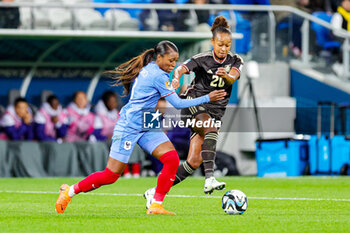 2023-07-24 - Atlanta Primus (20) of Jamaica holds off Grace Geyoro (8) of France during the 2023 FIFA Women’s World Cup, Group F football match between France and Jamaica on 23 July 2023 at Stadium Australia in Sydney, Australia - FOOTBALL - WOMEN'S WORLD CUP 2023 - FRANCE V JAMAICA - FIFA WORLD CUP - SOCCER