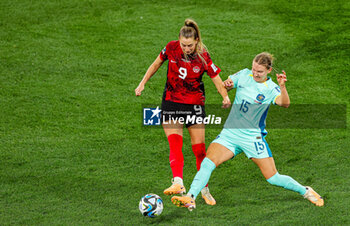 2023-08-01 - Clare Hunt (15) of Australia tackles Jordyn Huitema (9) of Canada during the 2023 FIFA Women’s World Cup, Group B football match between Canada and Australia on 31 July 2023 at Melbourne Rectangular Stadium in Melbourne, Australia - FOOTBALL - WOMEN'S WORLD CUP 2023 - CANADA V AUSTRALIA - FIFA WORLD CUP - SOCCER