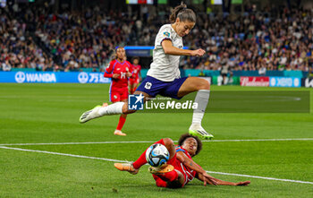 2023-08-02 - Yomira Pinzon (5) of Panama slides in and tackles Clara Mateo (12) of France during the 2023 FIFA Women’s World Cup, Group F football match between Panama and France on 2 August 2023 at Sydney Football Stadium in Sydney, Australia - FOOTBALL - WOMEN'S WORLD CUP 2023 - PANAMA V FRANCE - FIFA WORLD CUP - SOCCER