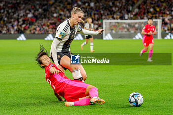 2023-08-03 - Choo Hyo-joo (2) of Korea Republic slides in and tackles Jule Brand (22) of Germany during the 2023 FIFA Women’s World Cup, Group H football match between Korea Republic and Germany on 3 August 2023 at Brisbane Stadium in Brisbane, Australia - FOOTBALL - WOMEN'S WORLD CUP 2023 - KOREA REPUBLIC V GERMANY - FIFA WORLD CUP - SOCCER