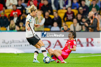 2023-08-03 - Lena Lattwein (14) of Germany tussles with Choe Yu-ri (11) of Korea Republic during the 2023 FIFA Women’s World Cup, Group H football match between Korea Republic and Germany on 3 August 2023 at Brisbane Stadium in Brisbane, Australia - FOOTBALL - WOMEN'S WORLD CUP 2023 - KOREA REPUBLIC V GERMANY - FIFA WORLD CUP - SOCCER