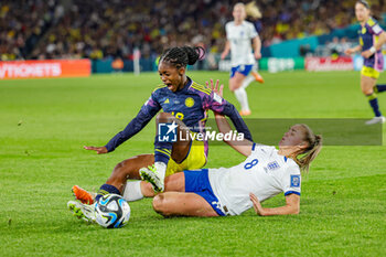 2023-08-13 - Georgia Stanway (8) of England slides in and tackles Linda Caicedo (18) of Colombia during the 2023 FIFA Women’s World Cup, quarter-final football match between England and Colombia on 12 August 2023 at Stadium Australia in Sydney, Australia - FOOTBALL - WOMEN'S WORLD CUP 2023 - ENGLAND V COLOMBIA - FIFA WORLD CUP - SOCCER