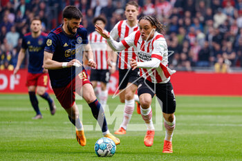 2023-04-23 - Florian Grillitsch of Ajax battle for possession with Xavi Simons of PSV during the Netherlands championship Eredivisie football match between PSV and Ajax on April 23, 2023 at Philips Stadion in Eindhoven, Netherlands - FOOTBALL - NETHERLANDS CHAMP - PSV V AJAX - NETHERLANDS EREDIVISIE - SOCCER