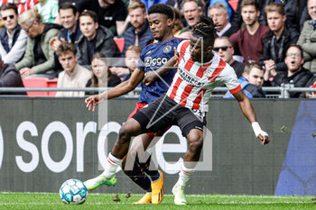 2023-04-23 - Jorrel Hato of Ajax, Johan Bakayoko of PSV during the Netherlands championship Eredivisie football match between PSV and Ajax on April 23, 2023 at Philips Stadion in Eindhoven, Netherlands - FOOTBALL - NETHERLANDS CHAMP - PSV V AJAX - NETHERLANDS EREDIVISIE - SOCCER