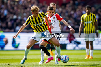 2023-05-28 - Melle Meulensteen of Vitesse is challenged by Sebastian Szymanski of Feyenoord during the Netherlands championship Eredivisie football match between Feyenoord and Vitesse on May 28, 2023 at Stadion Feijenoord in Rotterdam, Netherlands - FOOTBALL - NETHERLANDS CHAMP - FEYENOORD V VITESSE - NETHERLANDS EREDIVISIE - SOCCER